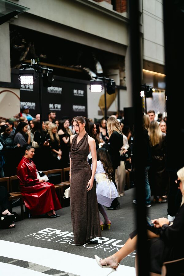 A model walking the runway past the front row